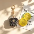 Retro luipaard pluche sleutelhanger mini portemonnee tas hanger stijlvol accessoire - Zwart en Grijs