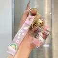 Cute cartoon liquid quicksand milk tea bottle keychain with pink strap sweet schoolbag pendant - Pink
