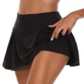 Detail view of black pleated tennis skort, featuring built-in safety shorts and high waist. - S / Bottoms / Black