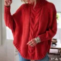 Cozy red turtleneck knit sweater featuring stylish batwing sleeves and cable knit design details. - Red