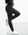High-waisted black yoga leggings with double stripe print, shaping athletic fitness pants. - Black