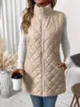 Detail view of a beige quilted puffer vest, mock neck, diamond pattern, stylish sleeveless outerwear. - S / Apricot
