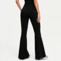 Back view detail of black high waisted cargo flare yoga pants with back button pockets. - S / Premium Black