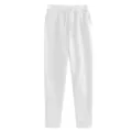 Detail view of solid white casual sweatpants featuring adjustable drawstring waistband. - S / White
