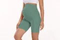 High-waisted maternity yoga shorts in green, supportive belly fitness activewear variant. - Light Green