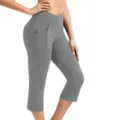 Detail view of women's high-waist cropped yoga pants in solid gray with side and back pockets. - S / Gray