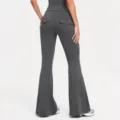 Back detail of dark grey high-waisted flare yoga pants with cargo pockets and button closure. - S / Reef Gray