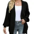 Close-up detail of the black coarse knit cardigan featuring stylish lantern sleeves and open front design. - S / Black