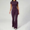 Detailed view of the soft purple short sleeve top and high waist flared yoga pants outfit. - Magenta