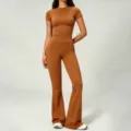 Women solid color short sleeve top and high waist flare yoga pants set for fitness workout. - Vibrant Orange