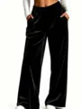 Black velvet wide leg pants detail showing high waist elastic band and soft draping fabric. - Black