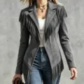 Detailed view of the stylish suede fringe jacket with lapel and long sleeves in elegant grey. - S / Tops / Gray