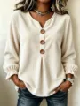 Close-up detail of womens corduroy long sleeve blouse V neck wooden buttons casual shirt top - S / Tops / Off White