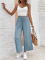 Detail shot of casual light blue wide-leg pants with comfortable drawstring waist style. - Sky Blue