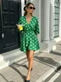 Green polka dot wrap dress for women featuring a chic V-neck, short sleeves and a high waist. - Green