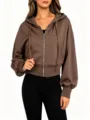 Casual women's brown zip-up hoodie featuring a relaxed drop shoulder design and cropped fit. - S / Tops / Coffee