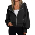 Detailed view of black zip-up hoodie featuring metallic zipper and comfortable hood. - S / Tops / Black
