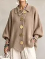 Detail shot of women's French lapel metal button cardigan, loose solid knitwear. - Khaki