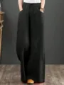 Detail view of the black ramie wide-leg pants, showing the elastic drawstring waist. - S / Bottoms / Black