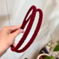 Detail view of the burgundy double-strand wool wrapped hair hoop, soft texture finish. - Burgundy