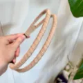 Detailed view of the double-strand wool wrapped headband, showcasing fine texture and chic style. - Beige