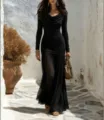 Gedetailleerd overzicht van de elegante zwarte lange mouw mesh fishtail maxi jurk met col. - S / Dresses / Zwart