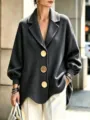 Close-up detail of the women's grey oversized wool coat featuring large gold metal buttons. - S / Tops / Gray