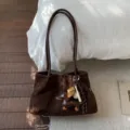Retro brown suede shoulder tote bag for women, stylish commuting handbag with cute charms. - Coffee With Charm