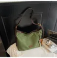 Green suede shoulder bag with brown leather straps and chic beaded pendant charm for women. - With Pendant / Green