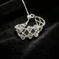 Close-up detail of silver beaded mesh ring with clear crystal beads and adjustable slide closure. - Silver Beaded Pull Style / White