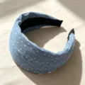 Detailed view of the blue pleated polka dot wide headband showing fine fabric texture - Blue Polka Dot