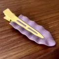 Close-up detail of the summer cream metal wavy duckbill hair clip for daily sweet styling. - Purple Wave & Yellow Clip