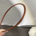 Minimalist brown PU leather thin hair hoop, delicate stitching detail for daily chic use. - Orange PU Leather Thin Headband