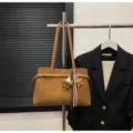 Brown suede shoulder bag for women, chic commuting tote with cute bear pendant and belt detail. - With Pendant / Brown