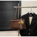Stylish brown shoulder bag for women, retro tote bag with cute charms and belt decor. - With Pendant / Coffee
