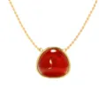 Gold-tone metal chain necklace featuring a smooth red cabochon gemstone pendant variant. - Gold + Red Agate Look