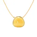Gold plated stainless steel necklace featuring a smooth yellow triangle gemstone pendant. - Gold + Yellow Chalcedony Look