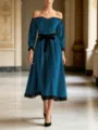Elegant velvet midi dress detail featuring off-shoulder design and delicate black lace trim. - Blue