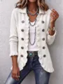 Detail view of women's white knit cardigan featuring chic ruffles and vintage buttons. - White