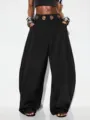 Zwarte hoge taille harembroek met metalen oogjes, zakdetails en stijlvolle losse pasvorm. - S / Bottoms / Zwart