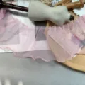Close-up detail of pink organza pleated ruffled lace trim, lightweight fabric for DIY sewing crafts. - 15cm / Pink
