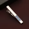 Detail shot of a silver men's tie clip featuring three square blue crystal embellishments. - Sky Blue Rhinestone Tie Clip (599) / Gift Box / Sky Blue