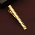 Detail view of a stylish gold tie clip with geometric engraved patterns for modern men - Business Engraved Style (New607)