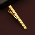 Gold-tone metal tie clip featuring diagonal textured pattern and sparkling crystal detail. - Diagonal 3D Style (New611)