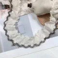 Detailed view of 5.5cm wide vintage cotton lace trim with cute brown butterfly embroidery. - 5.5cm / Black Border