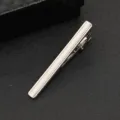 Close-up detail of a sleek silver metal tie clip for men, elegant business accessory. - Classic Streamlined Striped Style (J93)