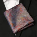Close up of blue and orange paisley pocket square detail, elegant suit accessory. - Blue With Orange Paisley Style / 1 Piece