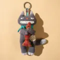 Cute grey fabric cat plush keychain with plaid fish pendant, creative handmade bag charm. - Sullen Gray
