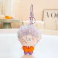 Cute fluffy doll keychain plush pendant with curly purple hair and orange outfit toy - Dr. C (Purple)