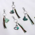 St. Patrick's Day clover heart leather tassel keychain stylish bag charm accessory. - Set
